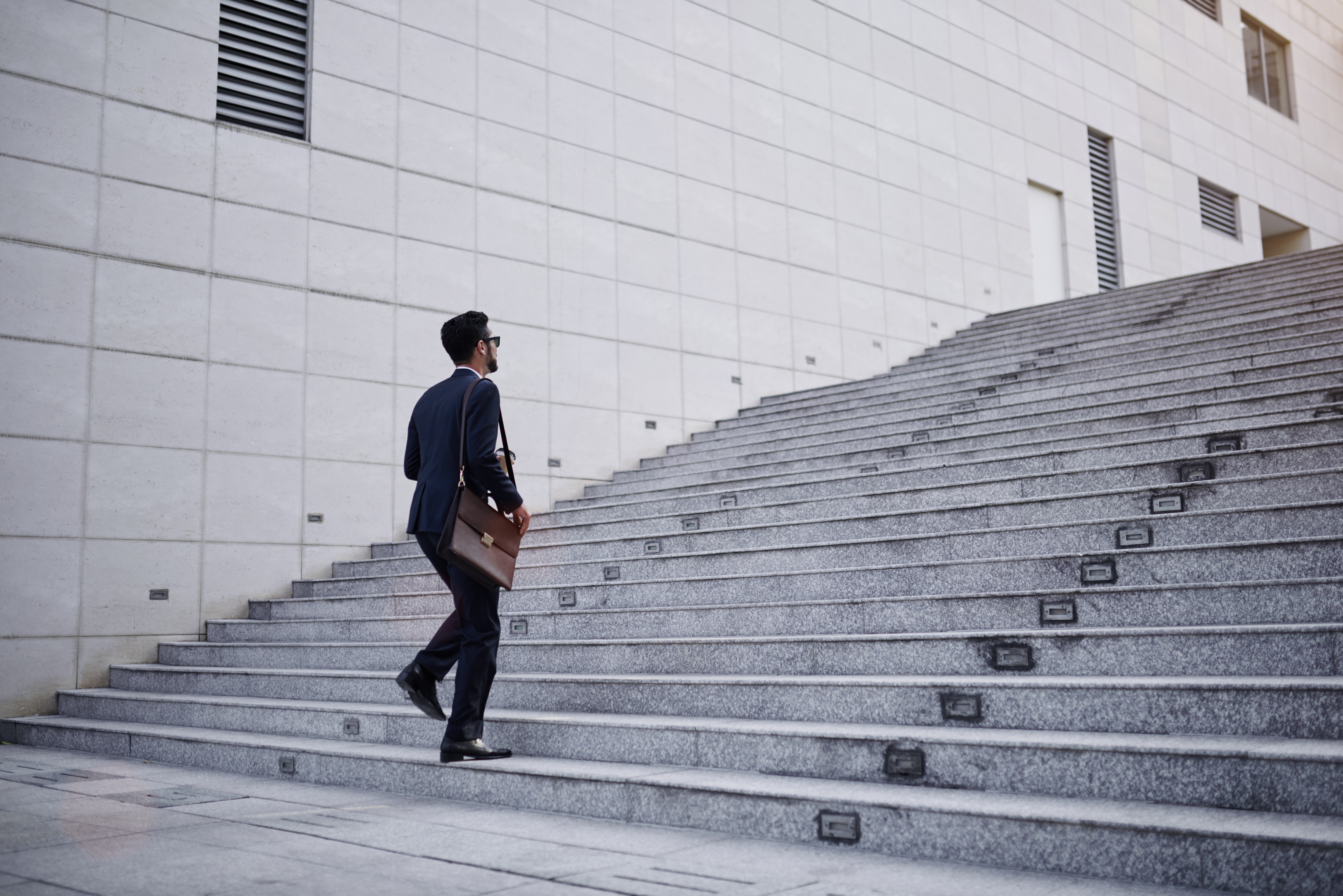 man walking up stairs