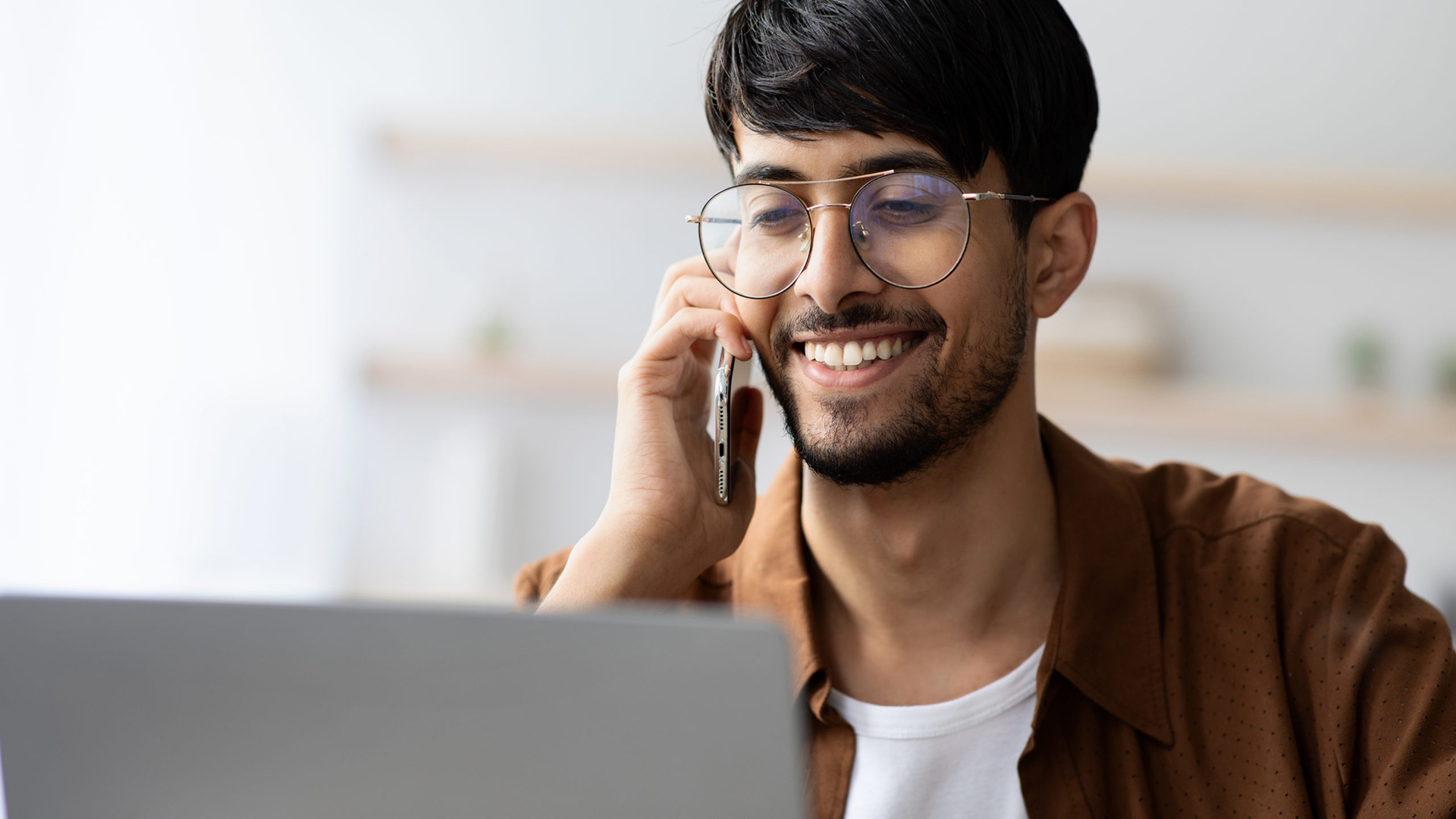 female remote worker uses laptop keyboards