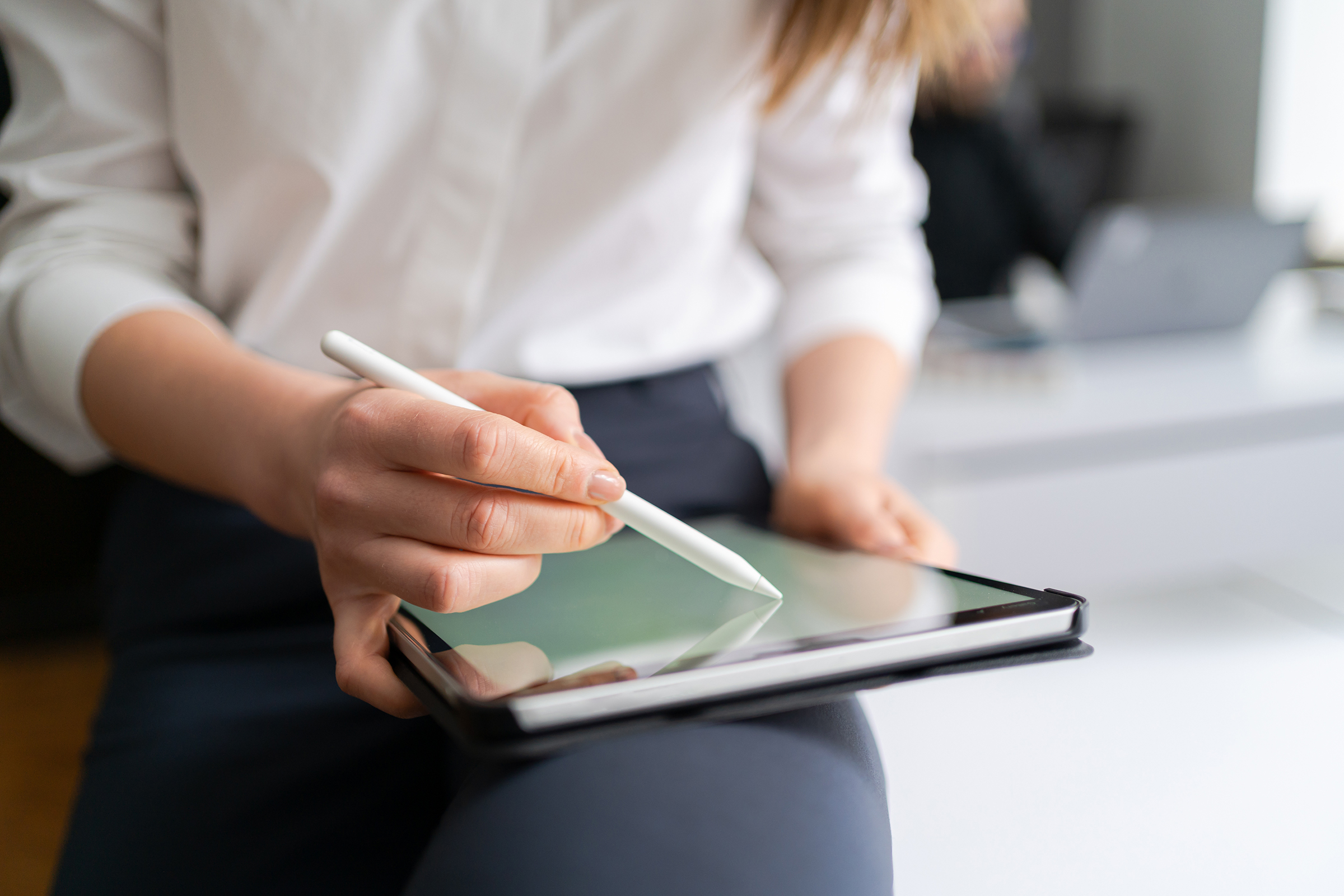 young woman holding a digital tablet