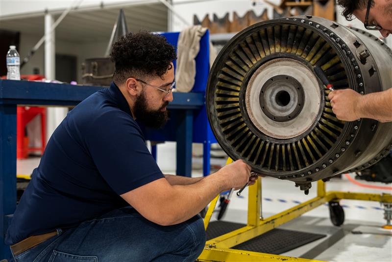 Happy young interracial couple shake hand of bank manager broker buy insurance services take mortgage loan, mixed ethnicity customers handshake agent make agreement financial business deal at meeting
