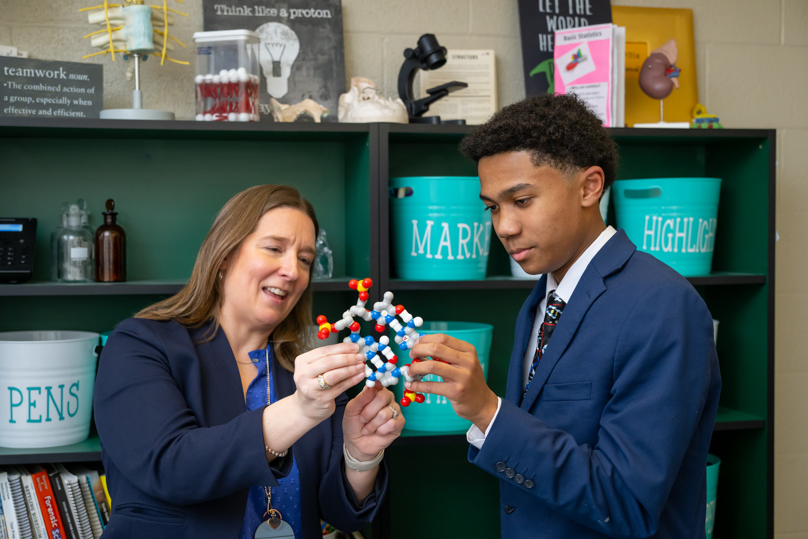 Happy young interracial couple shake hand of bank manager broker buy insurance services take mortgage loan, mixed ethnicity customers handshake agent make agreement financial business deal at meeting