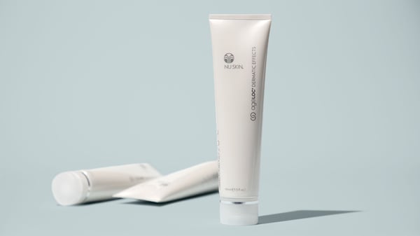 A tube of ageLOC Dermatic Effects displayed with other various ageLOC and WellSpa iO products.