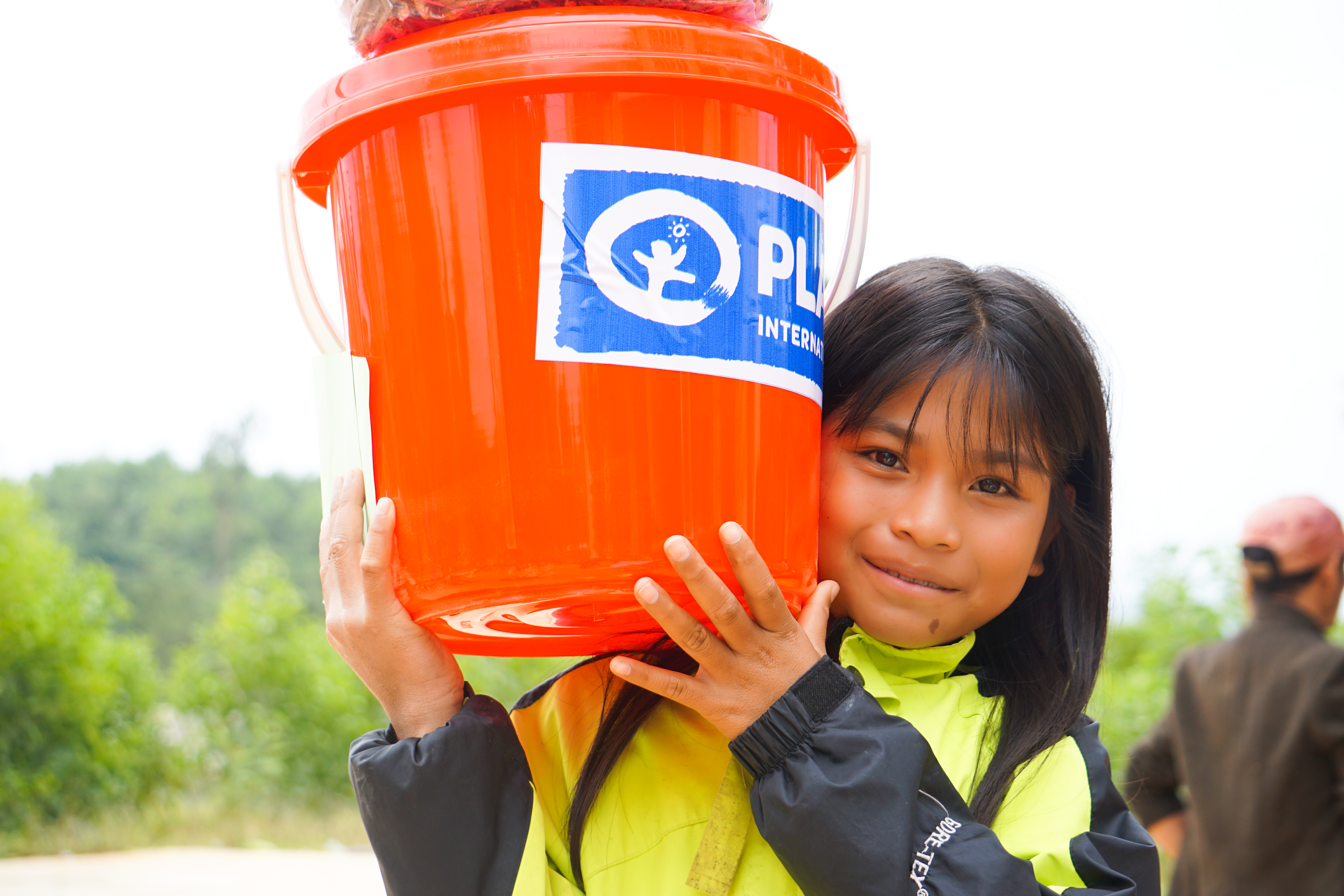 Girl holding hygiene kit, Vietnam (2020)