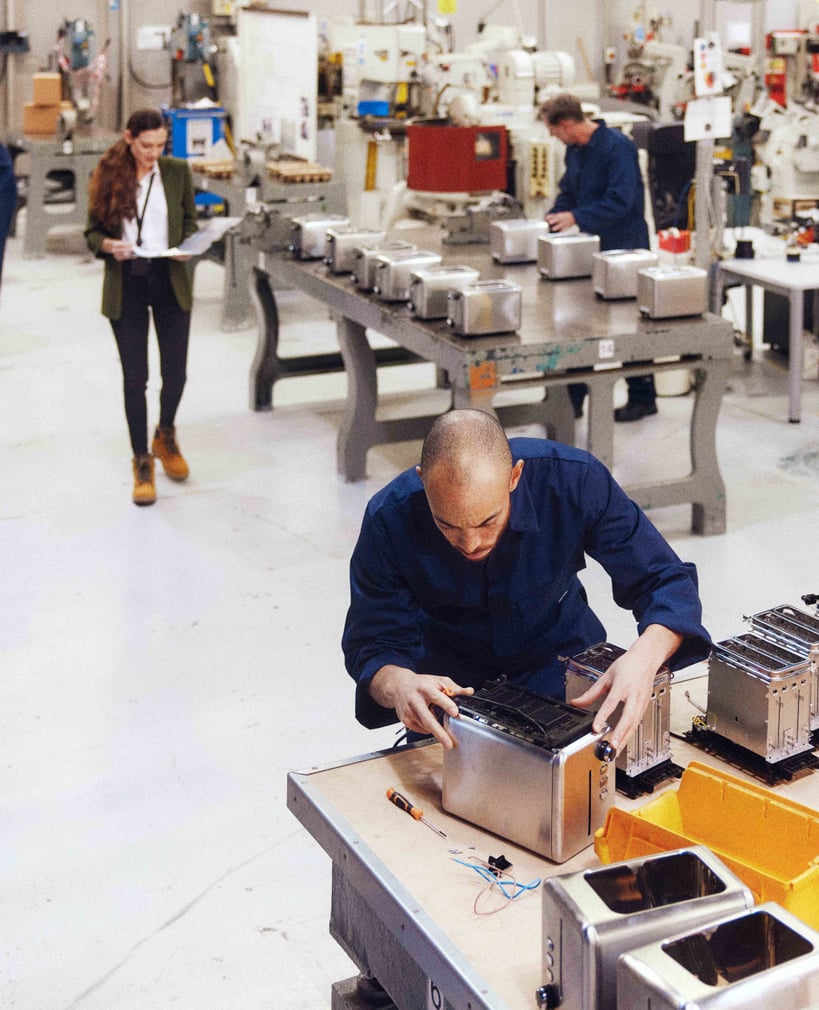 open space of warehouse with three persons