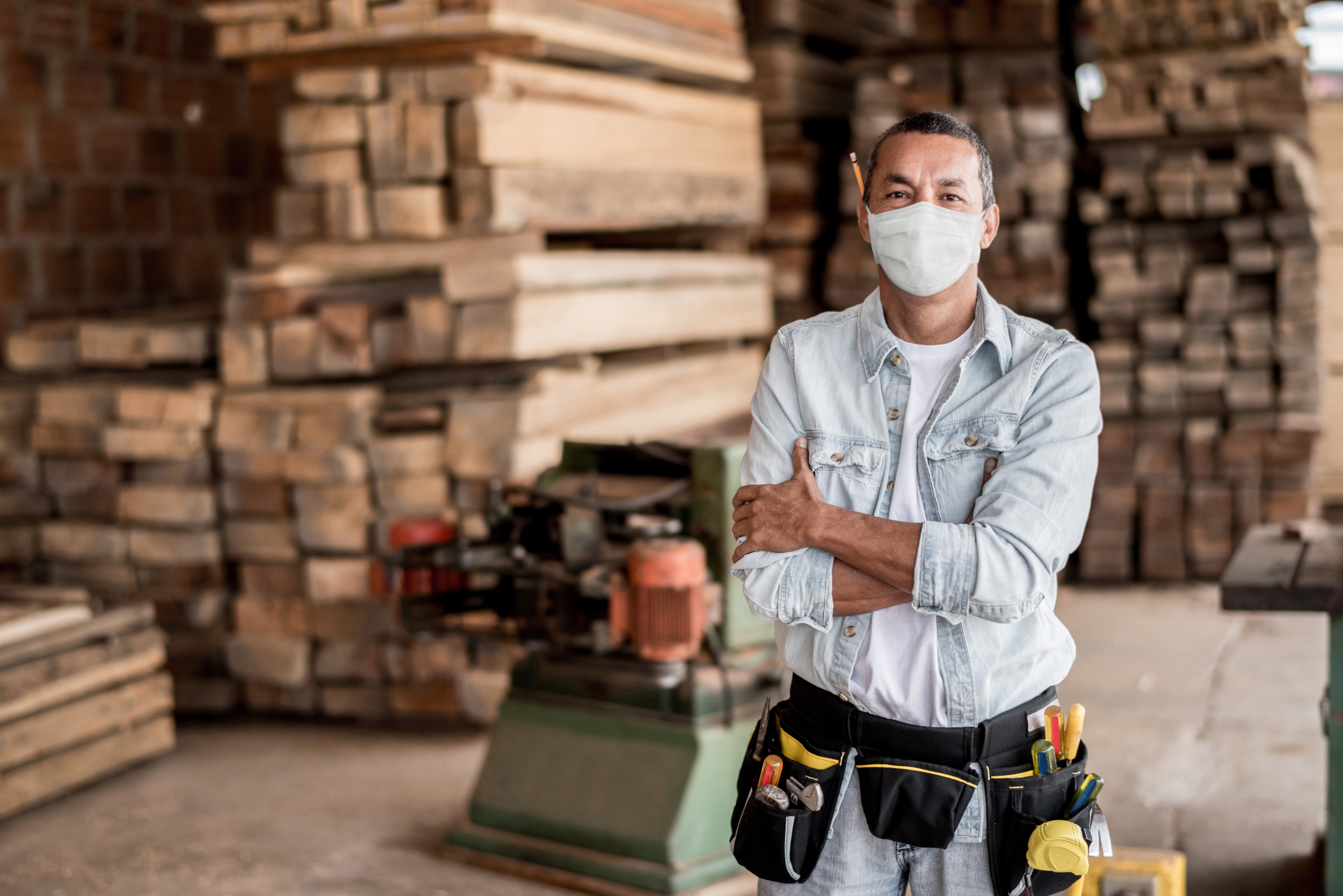 Economic Advancement Photo of man working in lumbar company